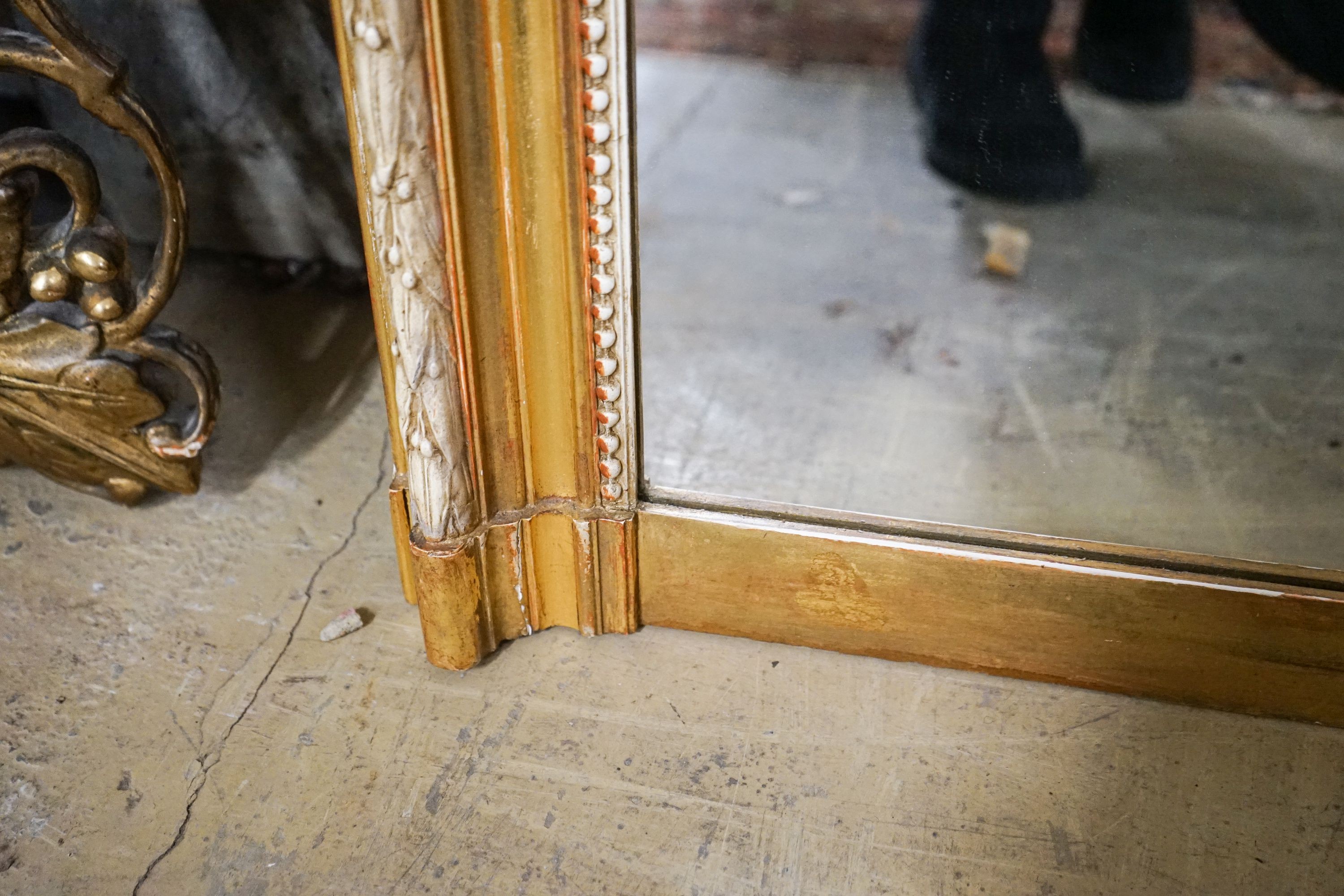 A large Victorian style rectangular carved giltwood overmantel mirror, width 109cm, height 156cm
